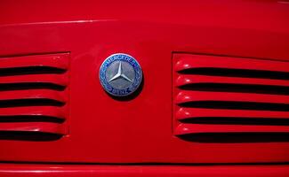 Minsk, Belarus, April 18, 2024 - Mercedes benz on retro red car photo