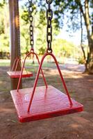 wooden and metal playground swing photo