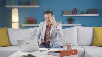 Home office worker man expressing his mind and success to the camera. video