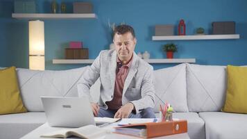 Home office worker man smiles at camera. video