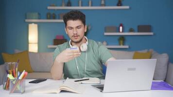 Male student doing e-commerce shopping. video