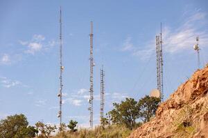 telecommunications antennas on top mountain photo