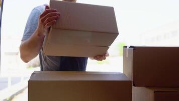 Delivery man unloads his cargo van prepare to send to customers video