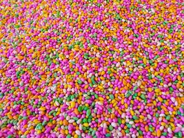 Sugar coated colorful Fennel seeds background - Colorful Candy Background photo