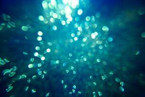 Sparkling glitter bokeh background with light. photo