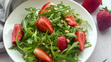 Vitamin salad of strawberry with arugula video