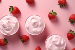 Bowl of strawberry ice cream surrounded by fresh strawberries on a white textured surface. photo