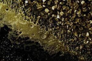 Black and golden marble textured background photo