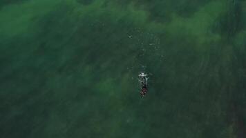 Aerial view of wave on the beach with sand and turquoise waves video