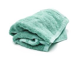 green towel isolated on white background photo