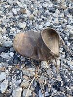 empty garbage can on the ground. pollution in the city. photo