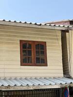 house with wooden window photo