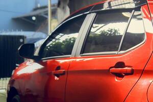 A red city car parked in the garage photo