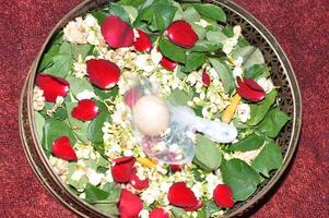 The procession is stepping on Javanese traditional wedding eggs photo