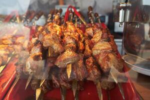 barbecue on skewers, raw meat photo