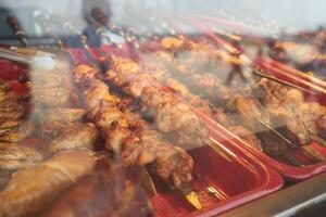 barbecue on skewers, raw meat photo