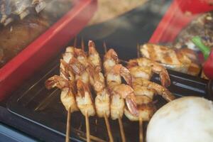 barbecue on skewers, raw meat photo