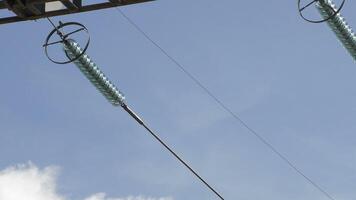 Electricity cable in high or medium voltage tower with clouds in the sky passing video