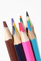 Color pencils standing on white background. close up of colored pencils photo