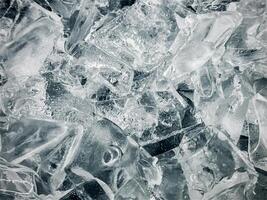 cubos de hielo fondo,cubitos de hielo textura, cubitos de hielo papel pintado, hielo ayuda a sensación refrescado y frio agua desde el cubos de hielo ayuda el agua actualizar tu vida y sensación bueno.hielo bebidas para refresco negocio foto