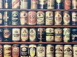 a shelf full of beer cans photo