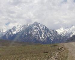 A big mountain and cloudy sky photo