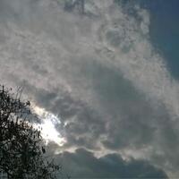 Clouds differ greatly in size, shape, and color. They can appear thin and wispy, or bulky and lumpy. photo