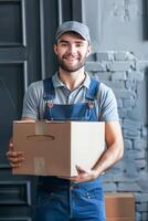 Smiling Delivery Man in Green Apron Holding a Package in a Modern Kitchen photo