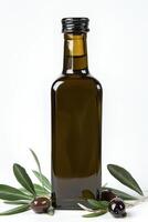 Glass Bottle of Olive Oil Beside Fresh Black Olives and Green Leaves on White Background photo