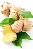 Fresh Ginger Root With Green Leaves on a White Background photo