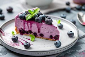 Slice of Blueberry Cheesecake With Fresh Berries on a White Plate, Elegantly Presented photo