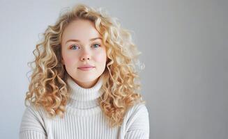 Portrait of a Young Woman With Blonde Balayage Hairstyle Indoors photo