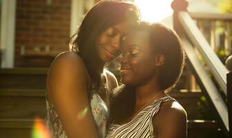 Tender African or Afro American Mother Daughter Moment Filled with Familial Warmth photo