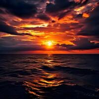 a sunset over the ocean with clouds and water photo