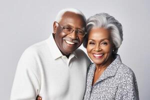 Happy black skin senior couple in light background. Concept of success in business and life. photo