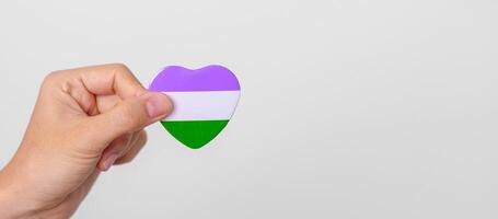 Queer Pride Day and LGBT pride month concept. purple, white and green heart shape for Lesbian, Gay, Bisexual, Transgender, genderqueer and Pansexual community photo