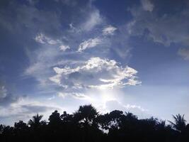 beautiful view, sunlight through white clouds and blue sky photo