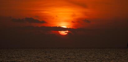 Sunset Beach Ocean of Thailand silhouette orange twilight photo