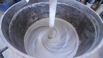 top view industrial mixer kneading large volume white paint, making white paint video