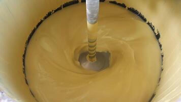 top view industrial mixer kneading large volume yellow paint making yellow paint video