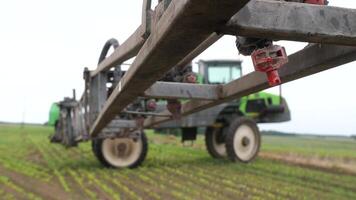 close-up tractor sprayer stopped at the edge of the field ready for work video