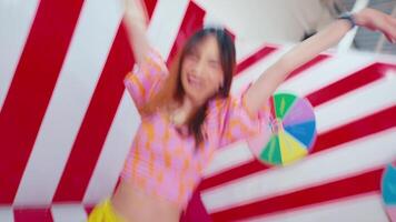 Abstract blur of a person walking in a vibrant, colorful corridor with geometric patterns and a spinning wheel. video