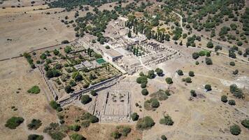 Aerial drone view of the Caliphate City of Medina Azahara in Cordoba. Archaeological site. Unesco World Heritage, Spain. Ancient civilization. Historic place. Touristic destination for holidays. photo