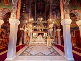 Interior shot of orthodox church. Religion. Christianity. Holy figures. Shiny altar. Interior of the Hercegovacka Gracanica Monastery in Trebinje, Bosnia and Herzegovina. photo