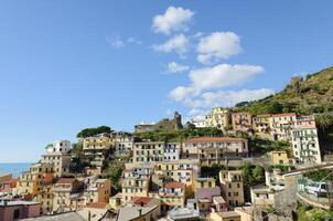 View of the famous seaside villages of Cinque Terre. Colorful houses and buildings. Fishing village. Touristic destination. Unesco world heritage site. photo