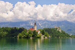 View of the magical Lake Bled in Slovenia. Church of the Mother of God on a little Island in the lake. photo