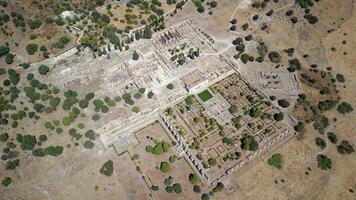 Aerial drone view of the Caliphate City of Medina Azahara in Cordoba. Archaeological site. Unesco World Heritage, Spain. Ancient civilization. Historic place. Touristic destination for holidays. photo