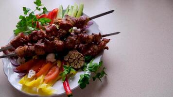 beef meat served with salad two skewers are put on a plate so much that they are cooked with meat kebabs place for text advertising restaurant delicious food home cooking grilled vegetables video