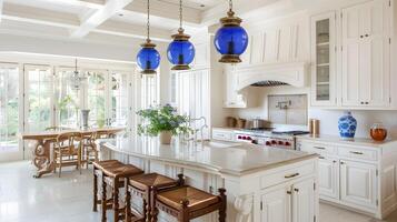 Spacious and Elegant Kitchen with Blue Glass Pendant Lights and Wooden Dining Table photo