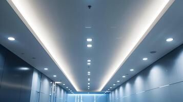 Sleek and Bright Architectural Corridor with Minimalist Lighting Design for Modern Office or Corporate Space photo